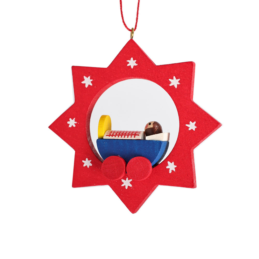 Wooden pendant star with child's cradle