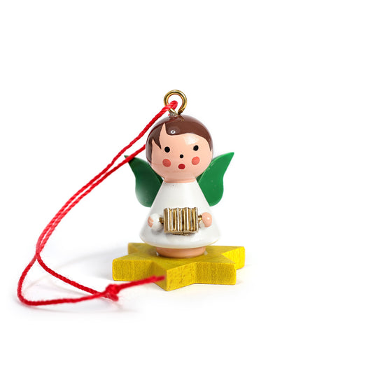 Little angel on yellow star with accordion