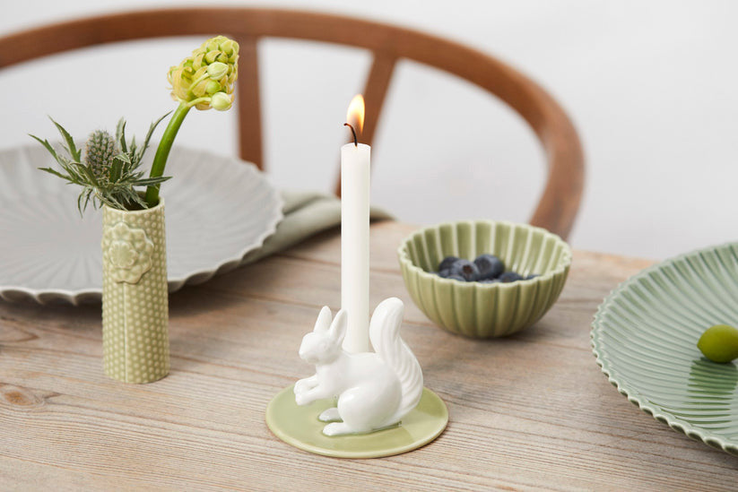 Porcelain candle holder with squirrel for candles ø 13mm