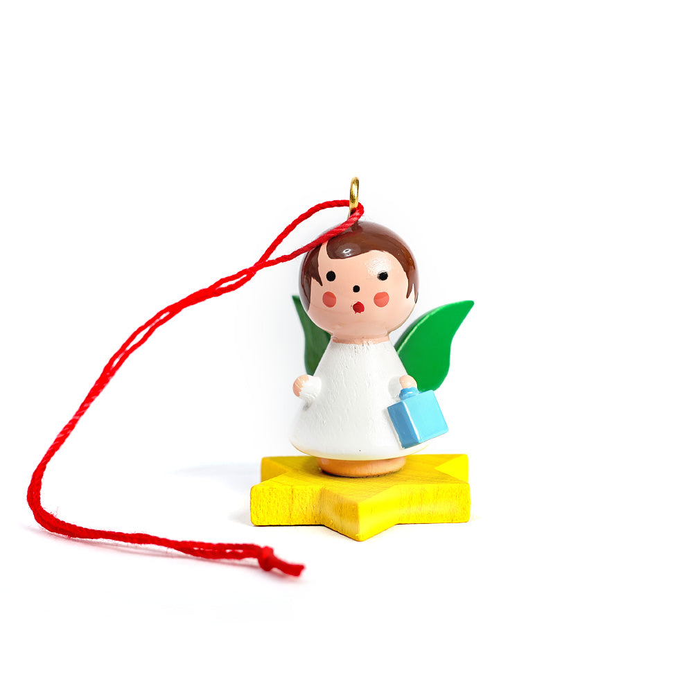 Little angel on yellow star with gift