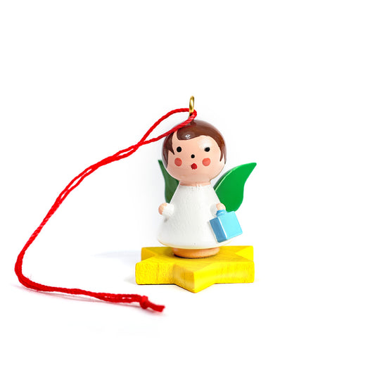 Little angel on yellow star with gift