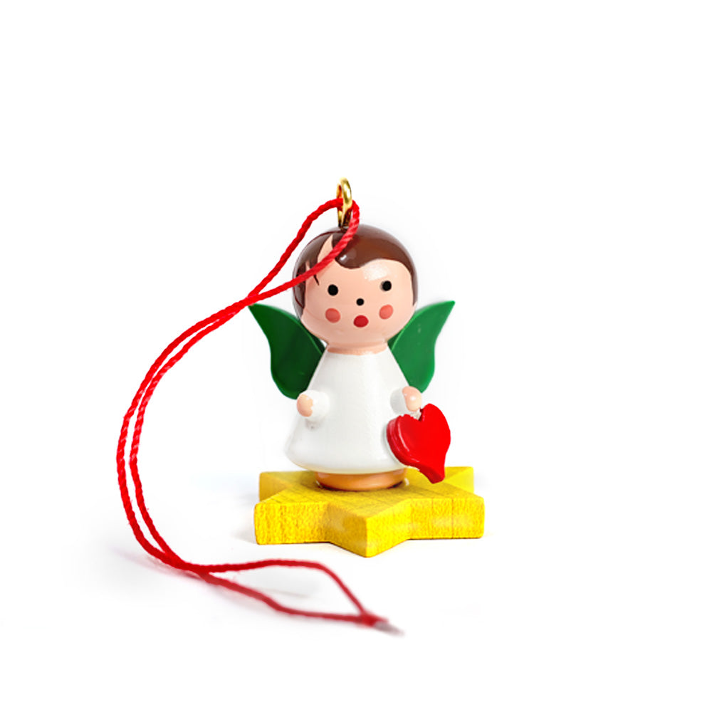 Little angel on yellow star with heart